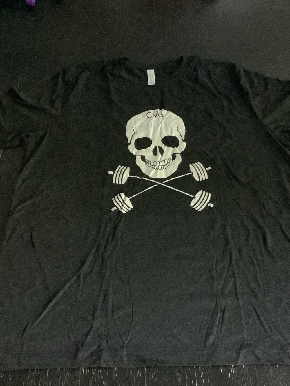 Bella Canvas Black Tee with White Skull and Crossed Barbells Graphic